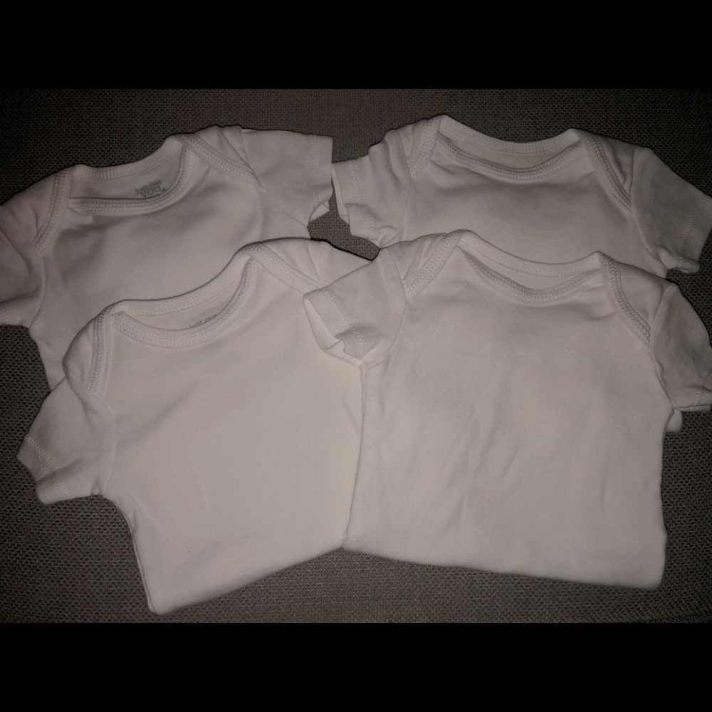 Four White Baby Onesies